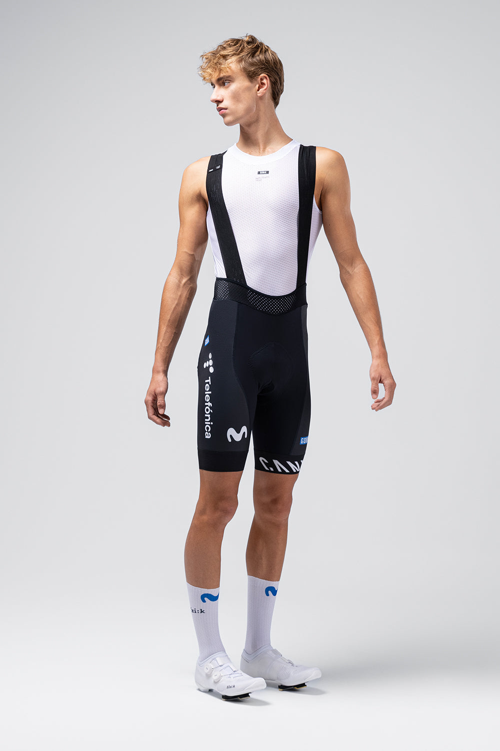 Gobik Limited 6.0 Bib Short in Movistar Team navy blue colorway on male model