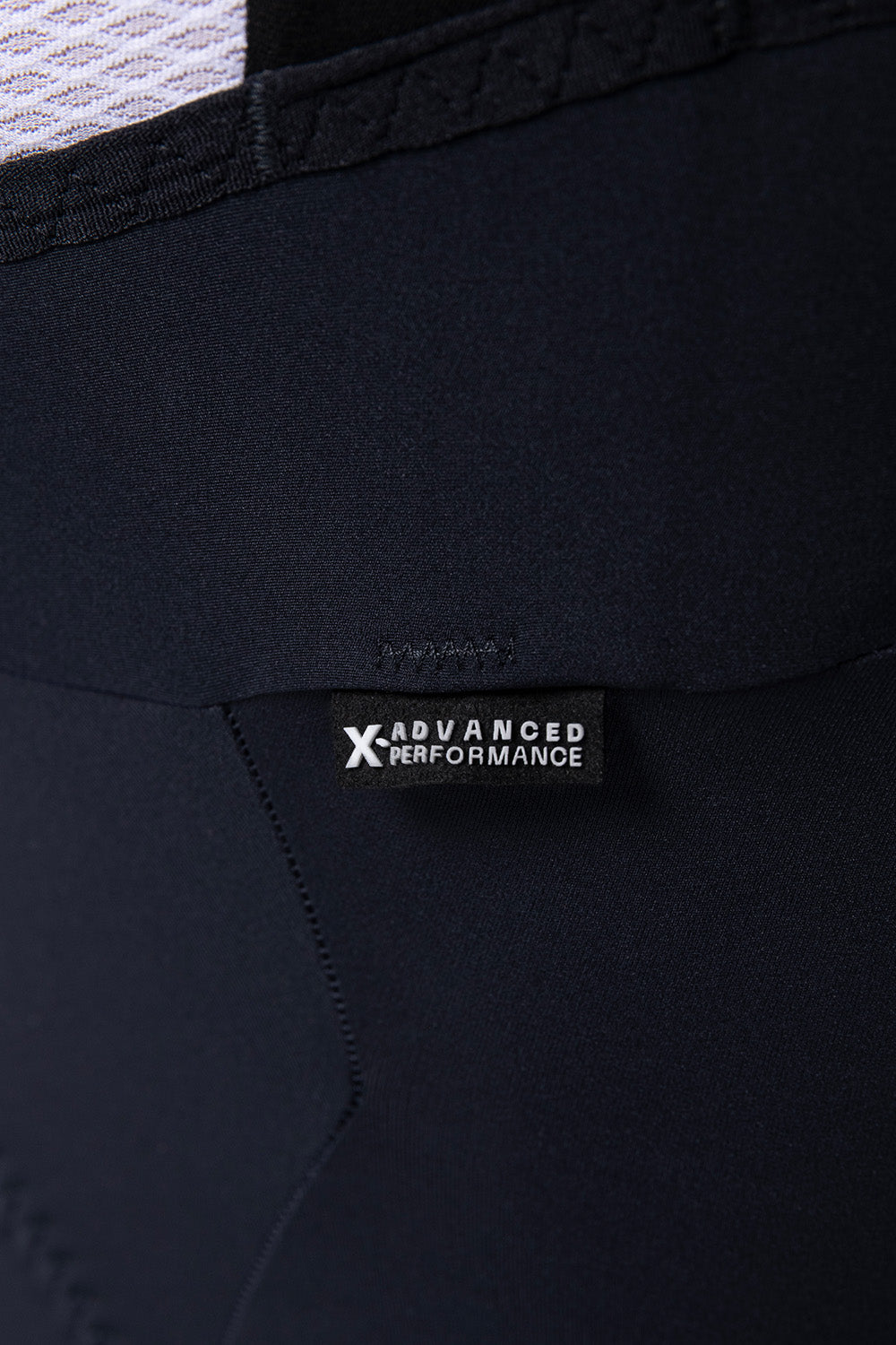 Close-up detail of Gobik X Advanced Performance bib shorts in navy blue fabric