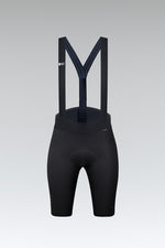 Black Gobik X women's cycling bib shorts with suspenders on gray background