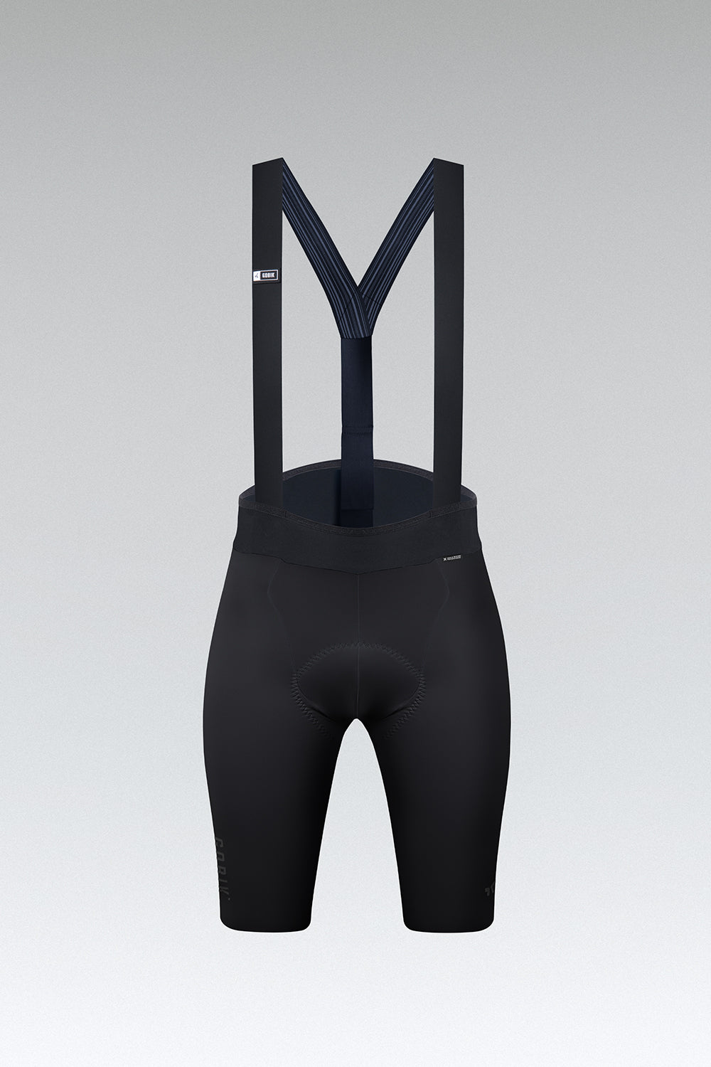 Black Gobik X women's cycling bib shorts with suspenders on gray background