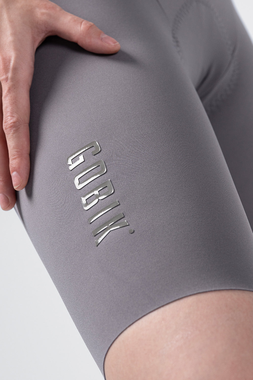 Gobik women's cycling bib shorts in gray with embossed logo detail