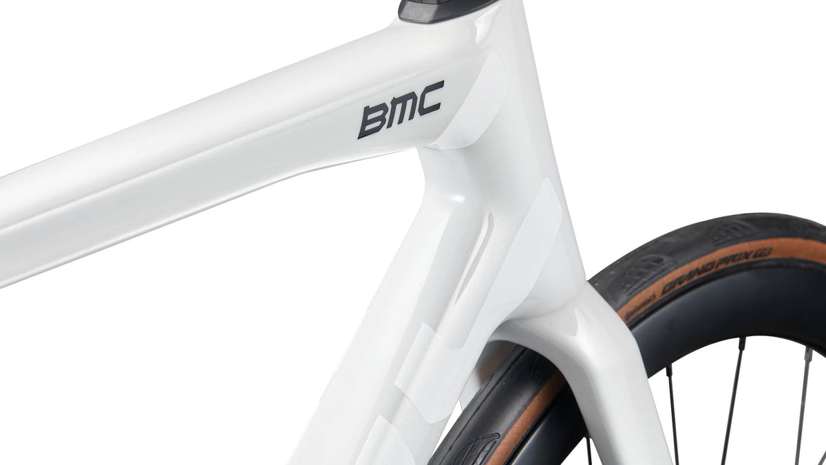 Close-up detail of BMC Teammachine SLR 01 head tube and fork junction in Stealth White