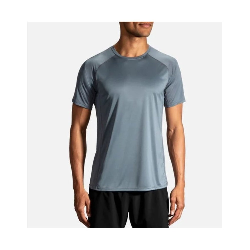 Man wearing Brooks Stealth short sleeve athletic shirt in slate blue-gray color