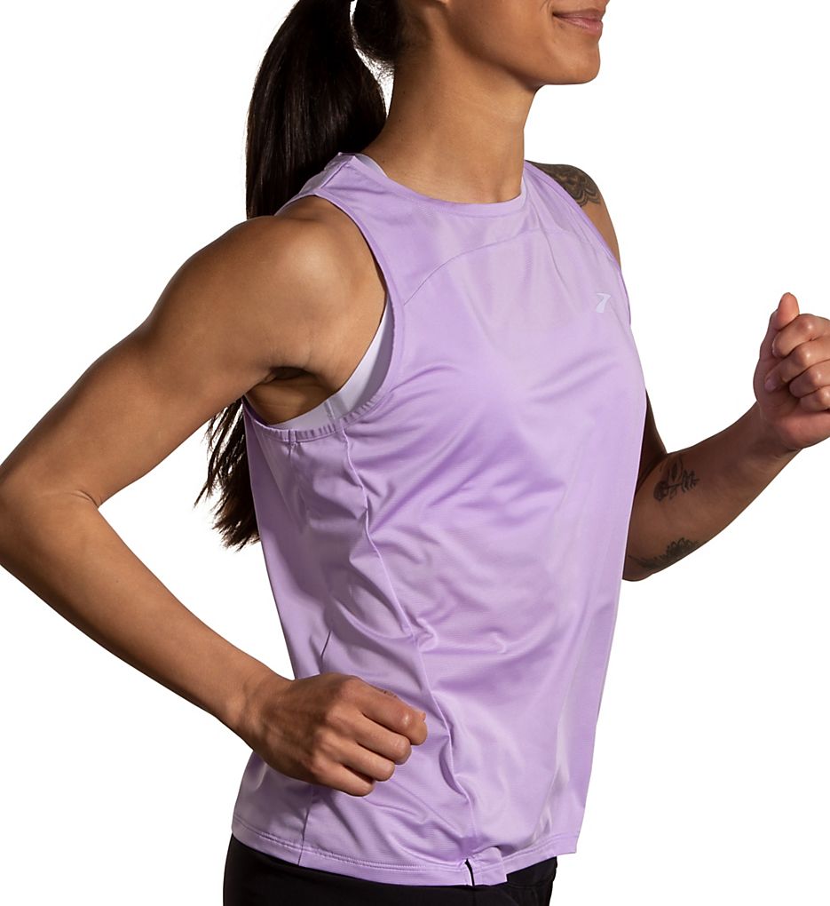Woman running in Brooks Sprint Free Tank 2.0 in light purple lavender colorway