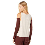 Brooks arm warmers in dark burgundy worn by female model, rear view