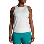 Brooks Sprint Free Tank 2.0 in white mint worn by female model with teal shorts