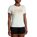 Women wearing Brooks Distance Short Sleeve 2.0 shirt in mint green with Run Happy text