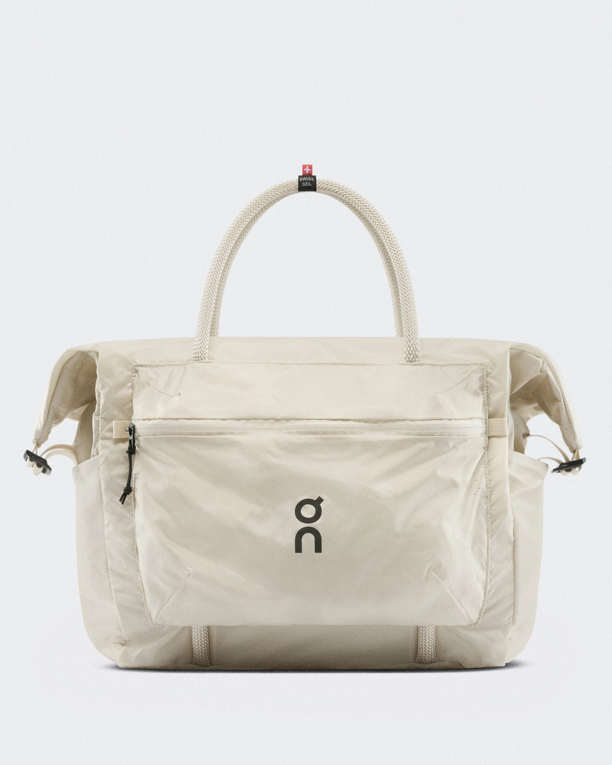 On Track Pack 35L Lite Unisex tote bag in cream with rope handles and On logo