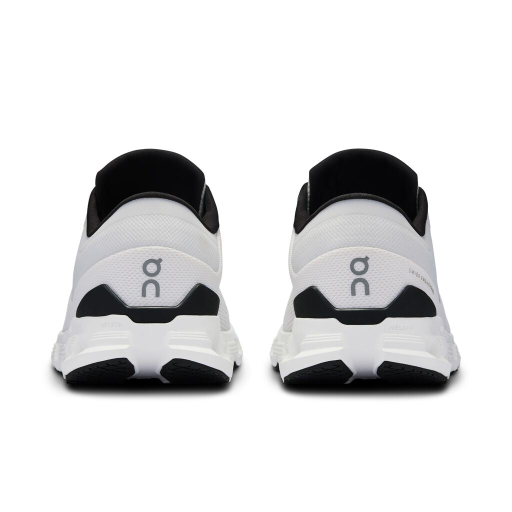 On Cloud X 4 running shoes in white and black colorway, rear view