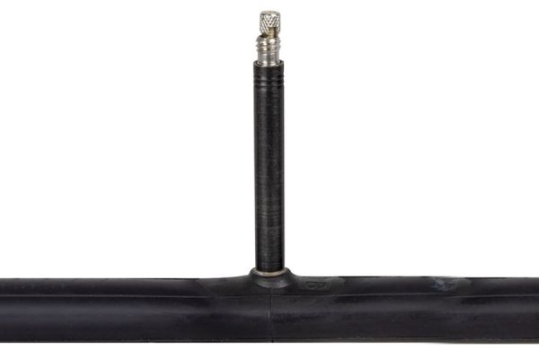 Black bicycle inner tube with Presta valve against white background