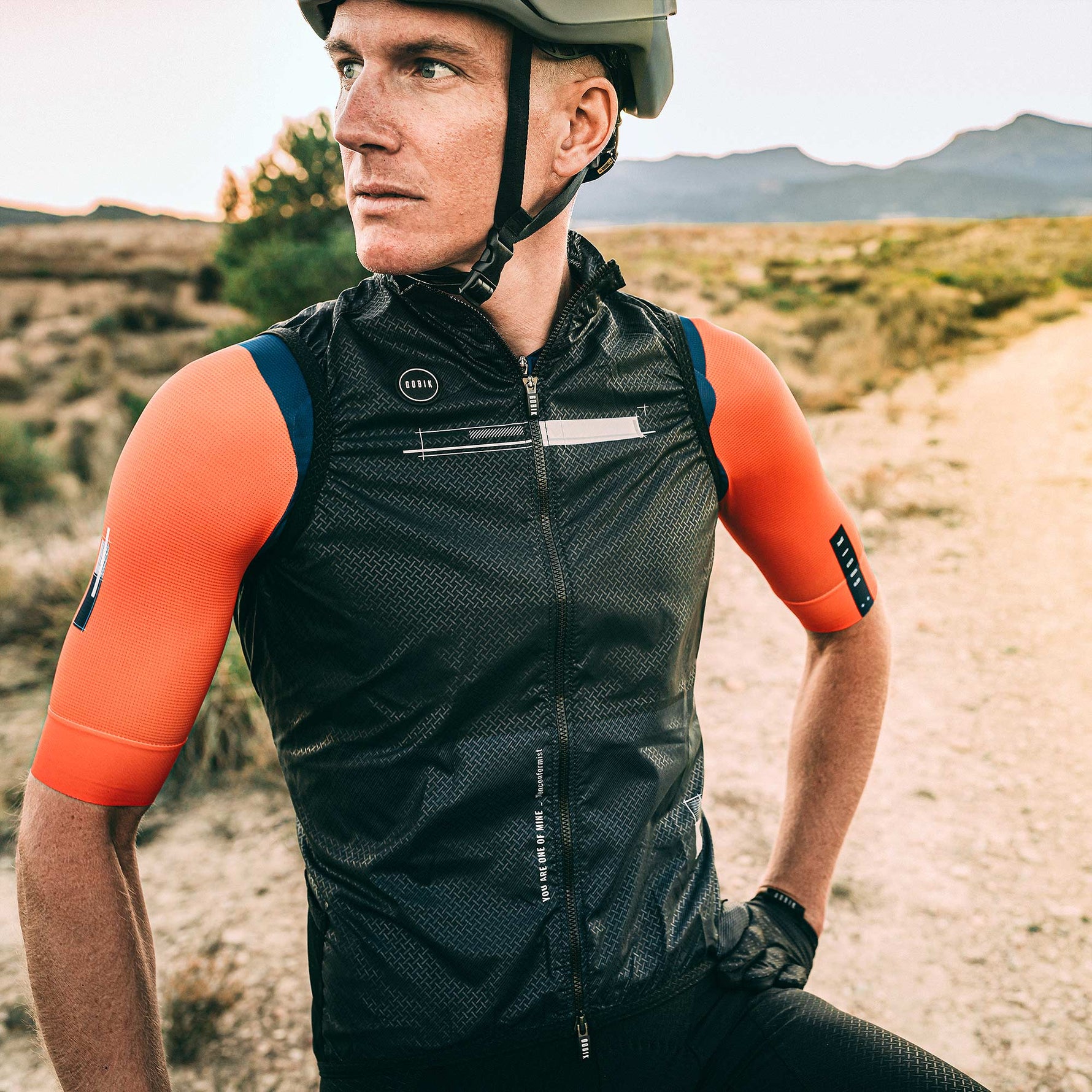 Gobik Vest Plus 2.0 Men's Citizen cycling vest in black with orange sleeves