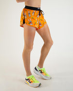 ChicknLegs 2-inch split running shorts in orange Bad Bunny print with cartoon rabbits