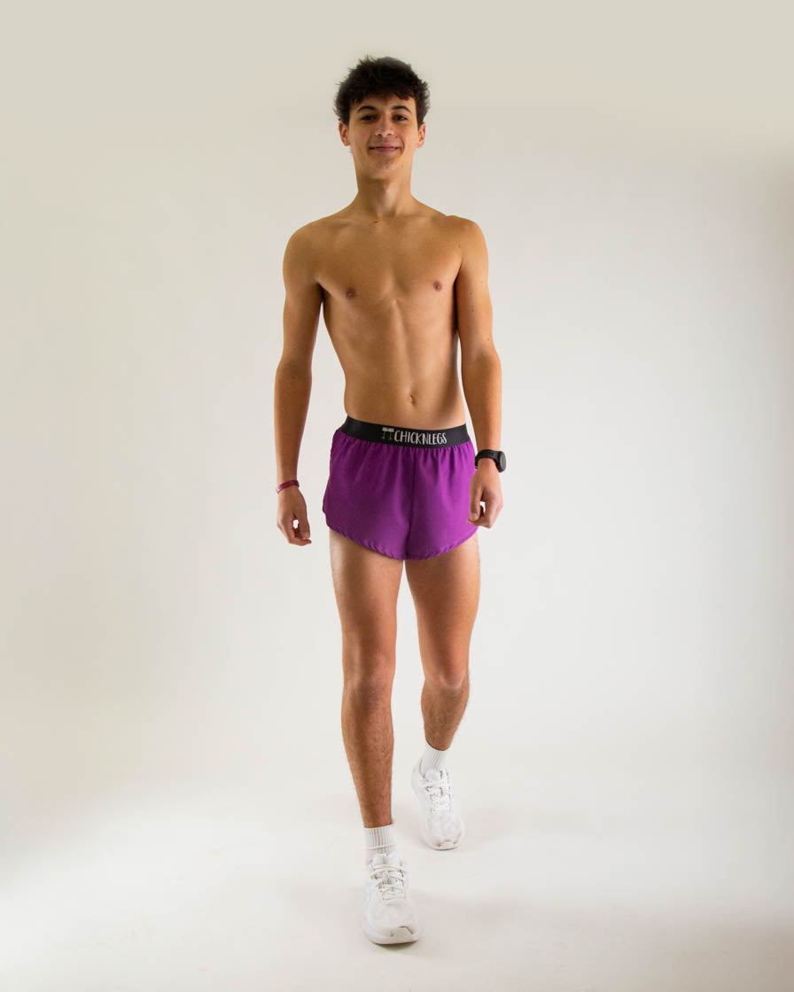 Man wearing Chicknlegs deep purple 2-inch split running shorts with black waistband