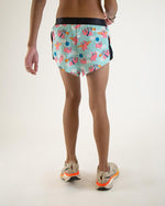ChicknLegs men's split running shorts with flying pig pattern in mint blue