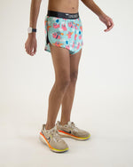 ChicknLegs men's split running shorts with flying pigs pattern on light blue background