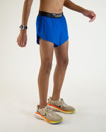 Man wearing sky blue Chicknlegs 2-inch split running shorts with black waistband
