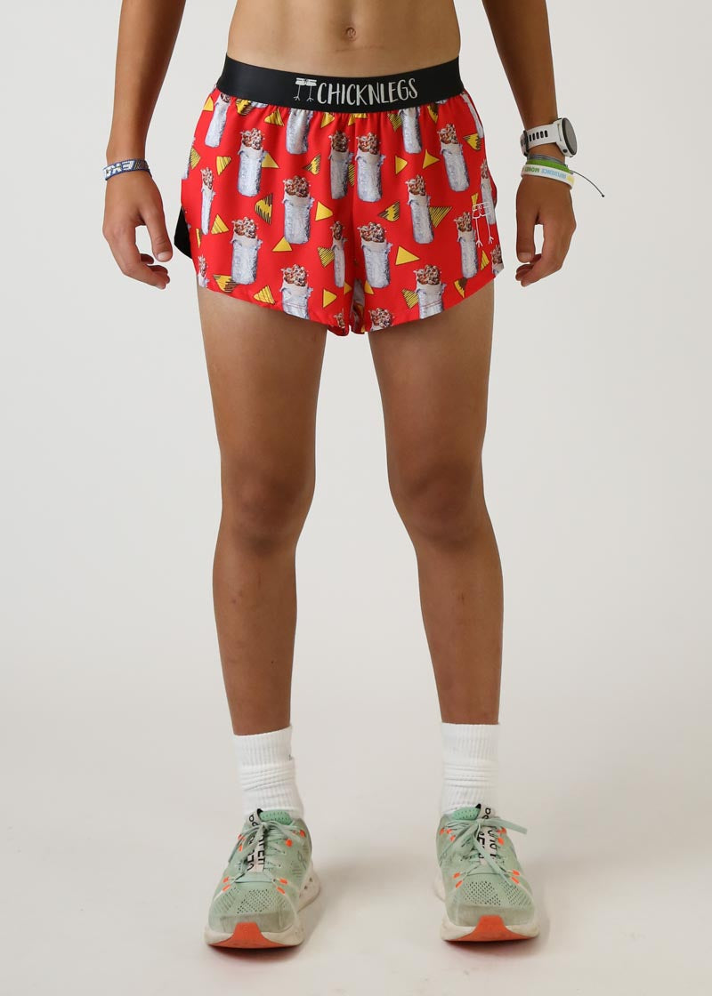 Red athletic shorts with burrito and nacho pattern, Chicknlegs brand waistband
