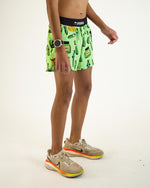 ChicknLegs men's bright green shorts with pickle print pattern and black waistband