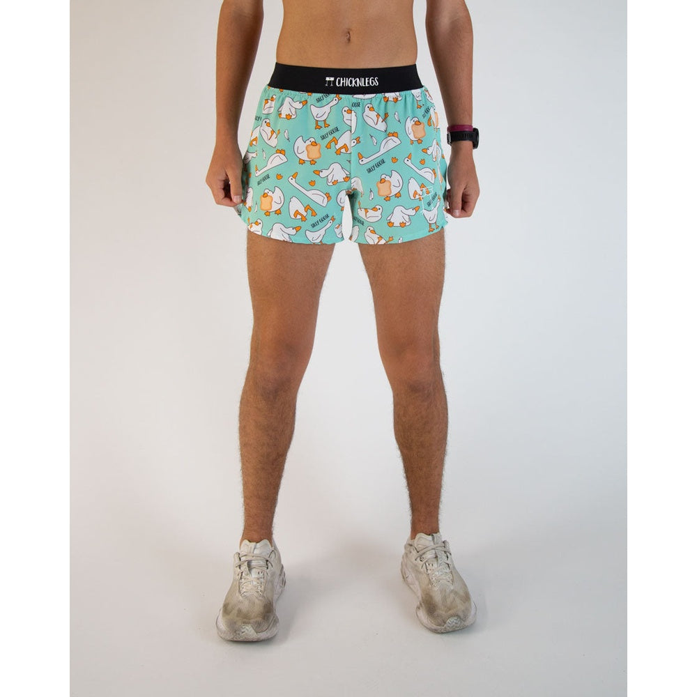 ChicknLegs men's turquoise running shorts with silly goose pattern on model