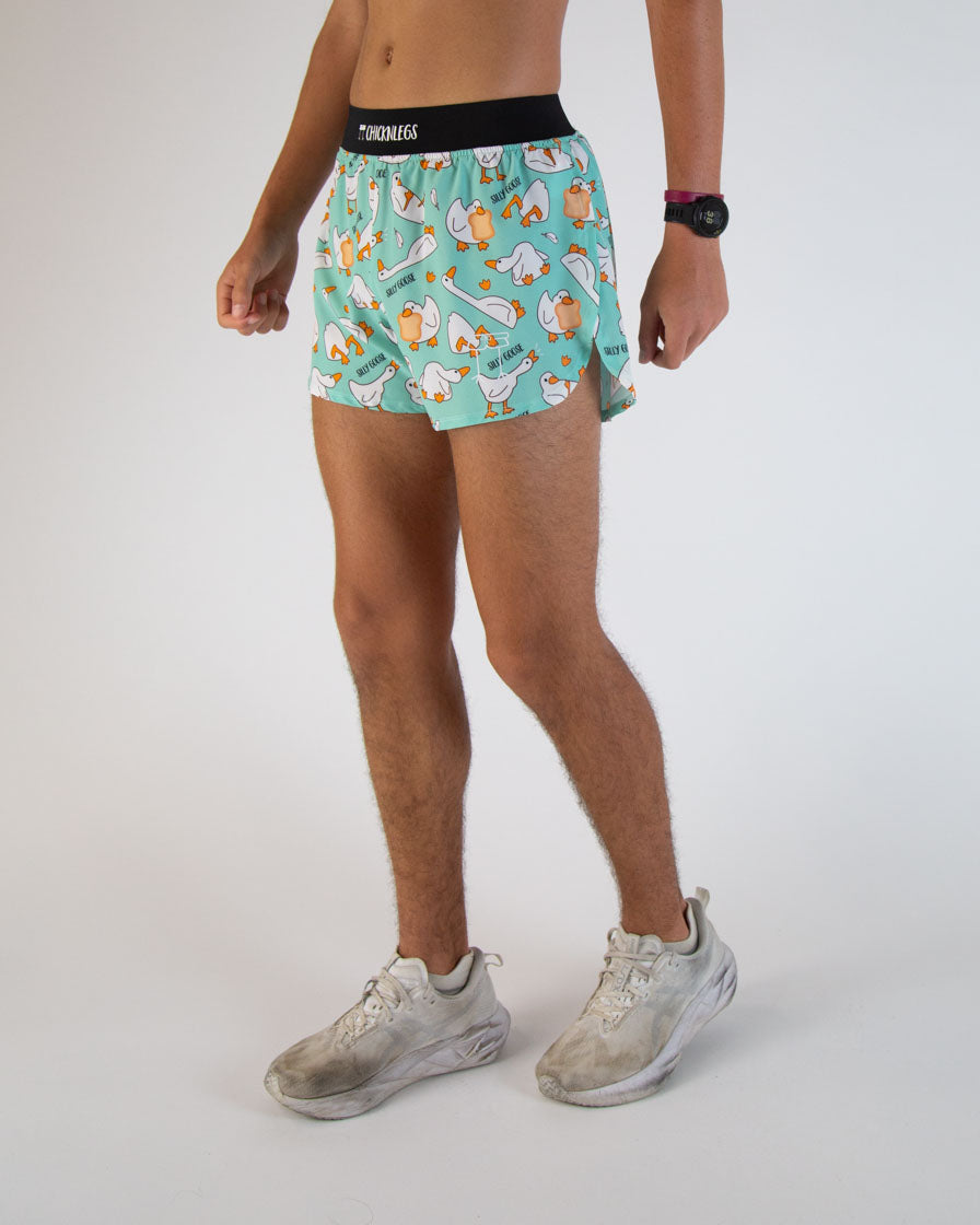 ChicknLegs men's running shorts with silly goose pattern on mint green background
