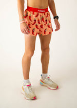 ChicknLegs men's running shorts with red chili pepper pattern on orange background