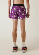 Purple men's running shorts with cartoon cow and chocolate print pattern