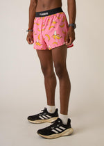 ChicknLegs pink shorts with yellow banana print worn by model in studio