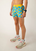 ChicknLegs men's blue running shorts with yellow rubber duck pattern and split sides