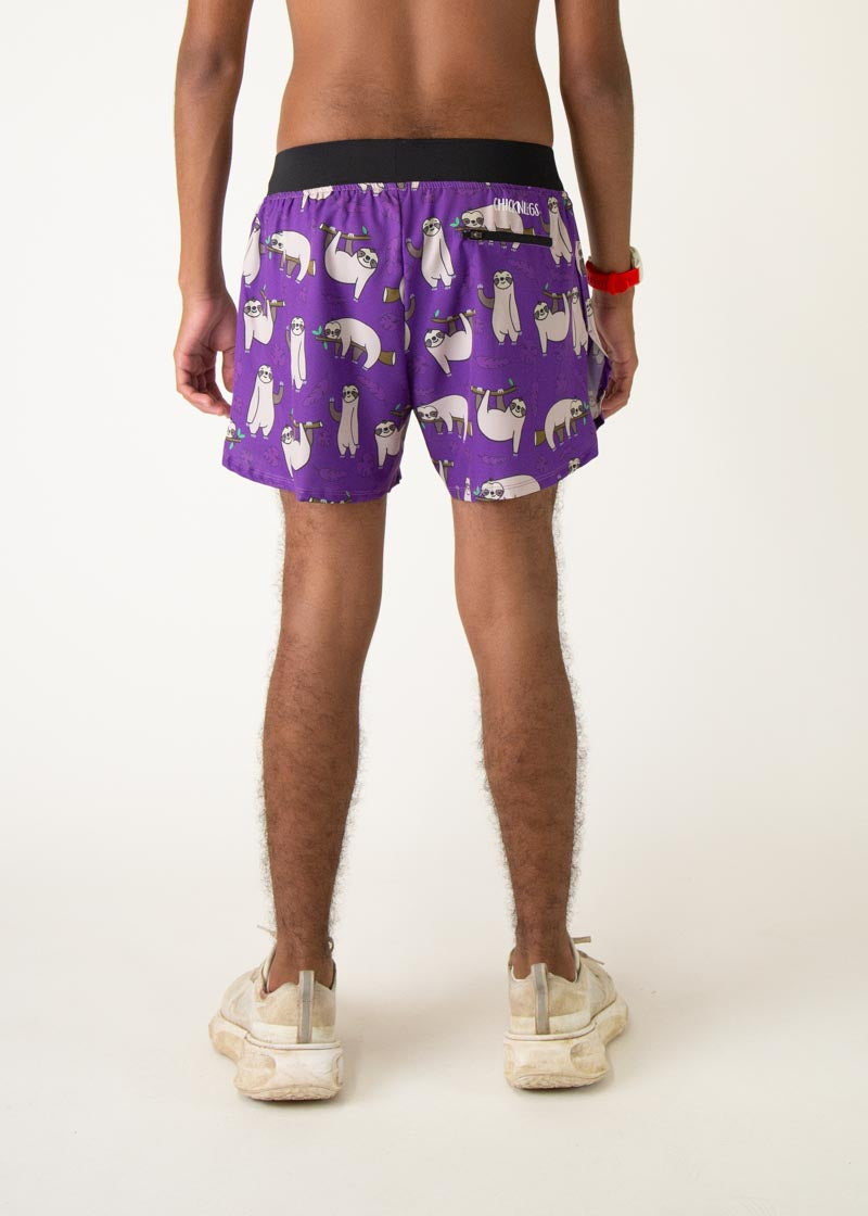 Purple men's shorts with cute sloth pattern print on model