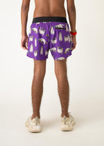 Purple men's running shorts with cute sloth print pattern, worn by male model