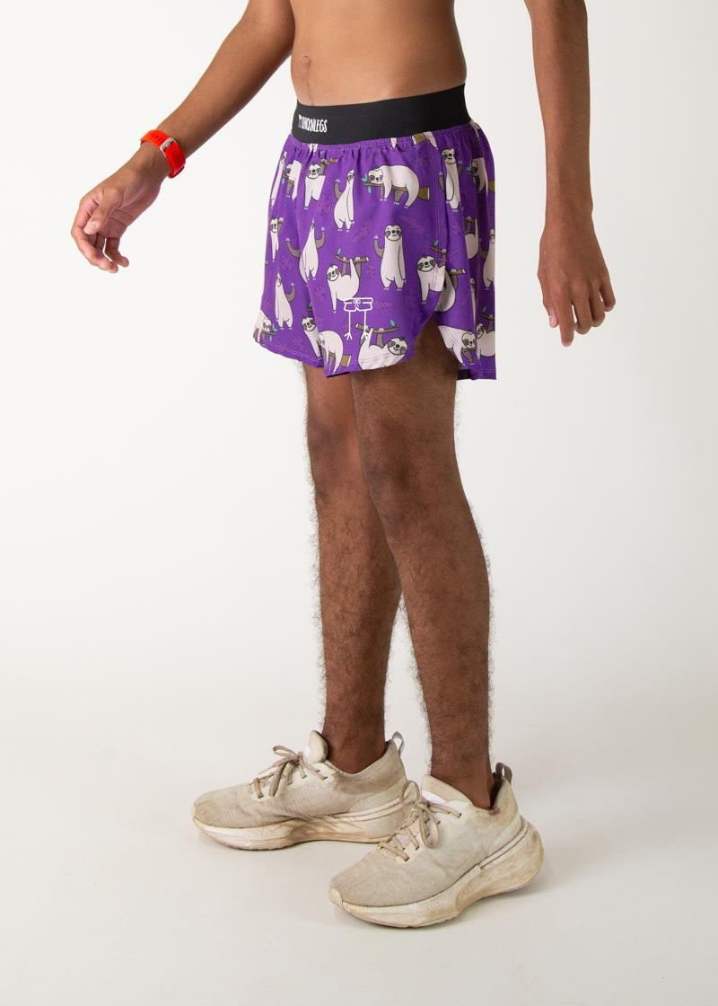 Man wearing purple ChicknLegs shorts with cute sloth print pattern
