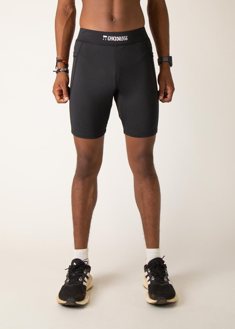Black ChicknLegs 8-inch half tights on male model against white background