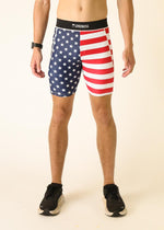 Man wearing ChicknLegs USA flag pattern compression shorts with blue stars and red stripes