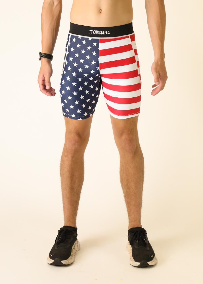 Man wearing ChicknLegs USA flag pattern compression shorts with blue stars and red stripes