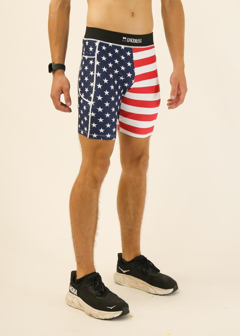 Man wearing ChicknLegs USA flag patterned compression shorts with stars and stripes design