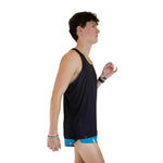 Man wearing black ChicknLegs performance singlet tank top with blue shorts