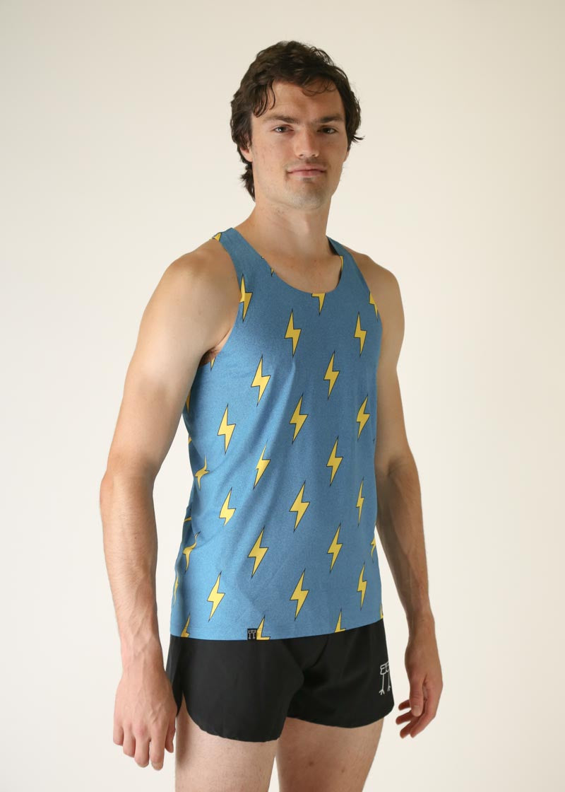 Man wearing blue athletic singlet with yellow lightning bolt pattern