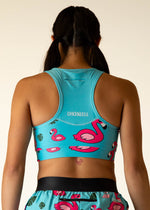 ChicknLegs OG Sports Bra in turquoise blue with pink flamingo print, back view