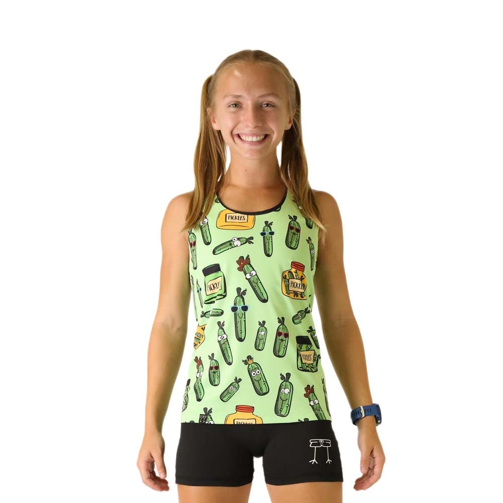 Woman wearing light green performance singlet with pickle pattern and black shorts