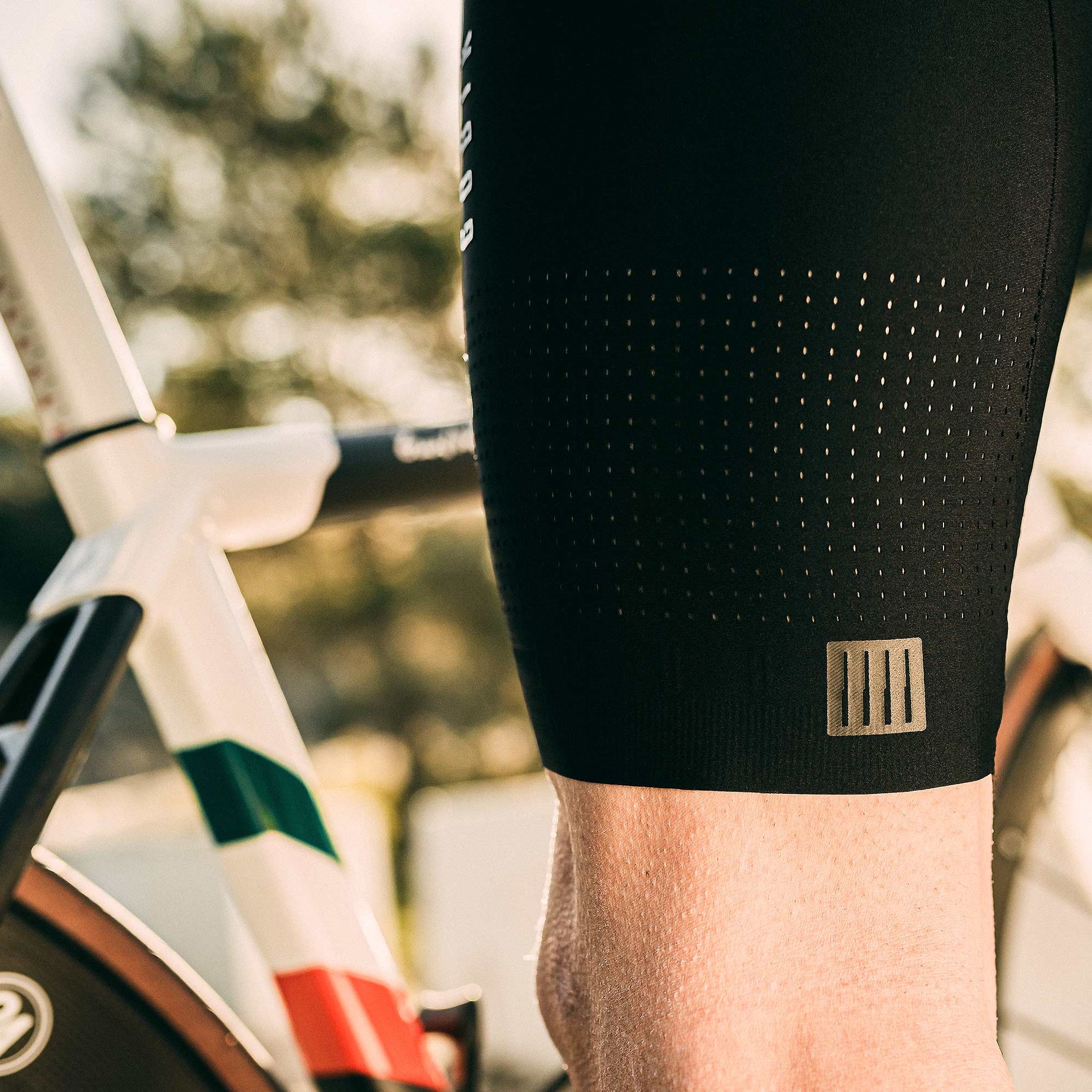 Close-up of black Gobik cycling shorts with perforated fabric and brand logo