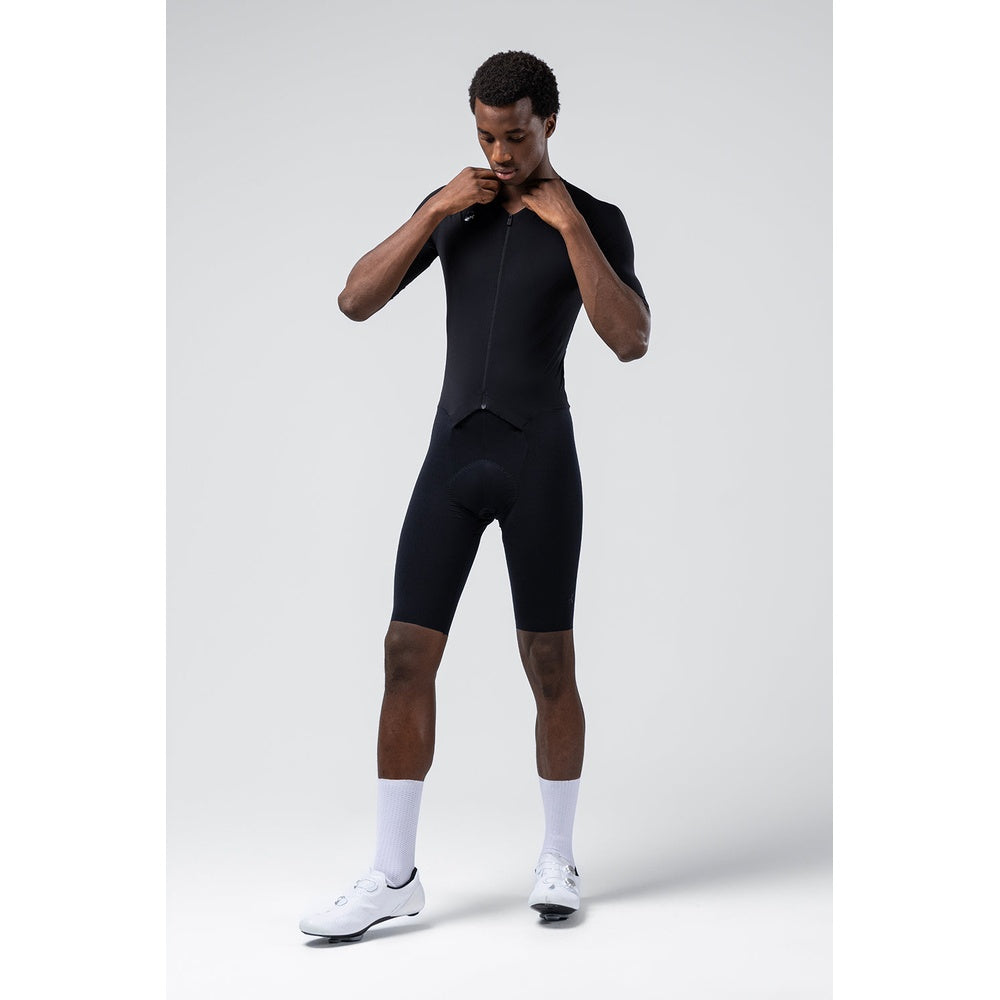 Man wearing black Gobik Integral Hudson cycling bodysuit with short sleeves