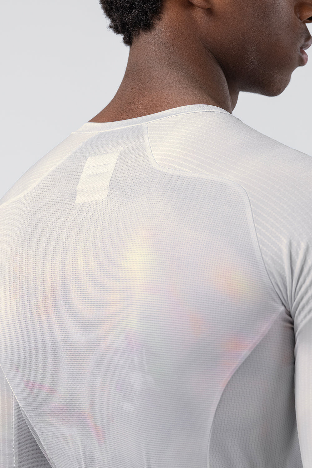 Close-up detail of Gobik Aerosuit Madison jersey back fabric showing iridescent texture