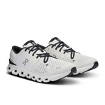 On Cloud X 4 running shoes in ivory white with black accents and laces