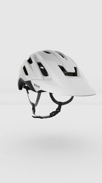 White KASK Caipi cycling helmet with ventilation holes and black chin strap
