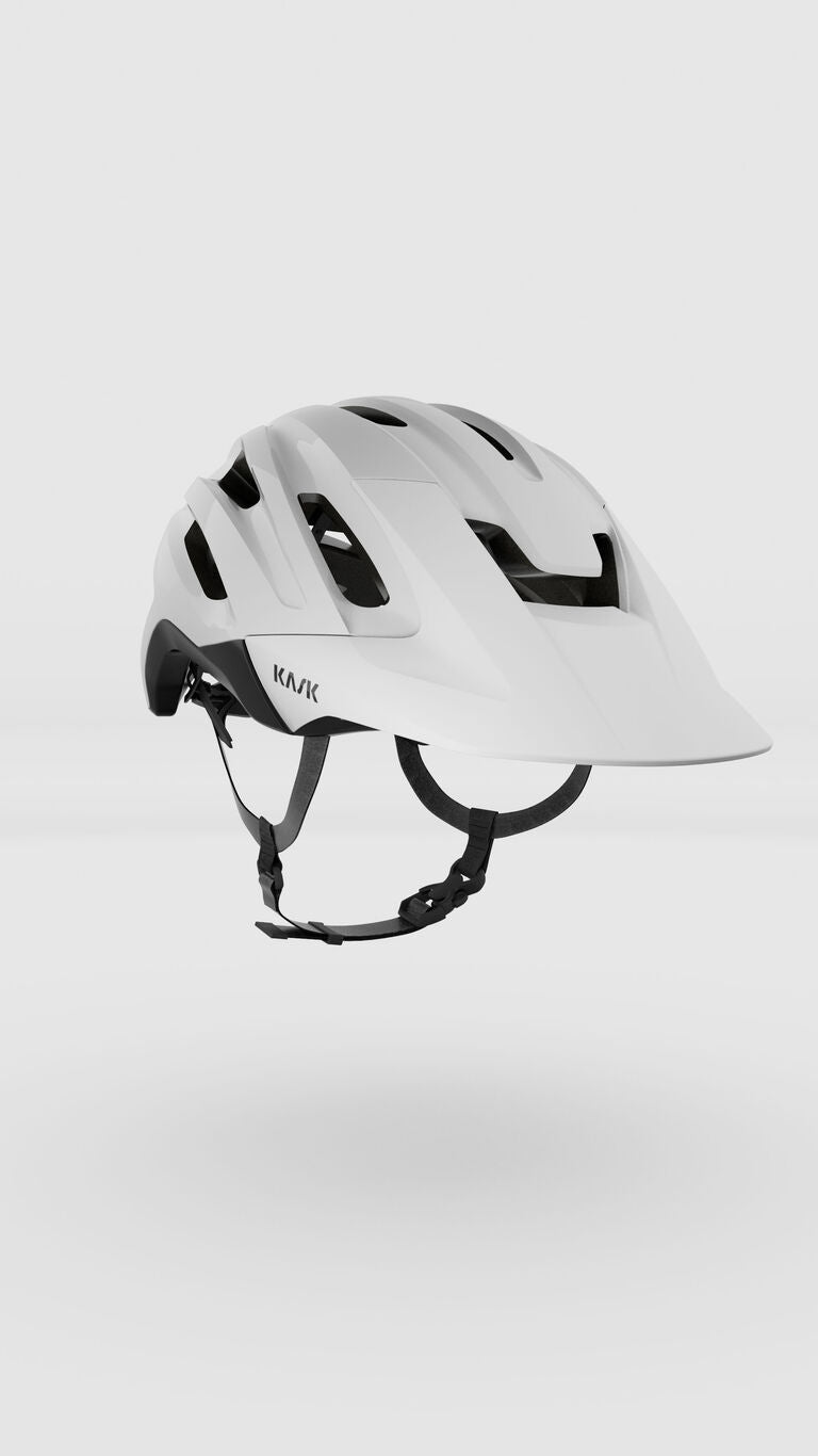 White KASK Caipi cycling helmet with ventilation holes and black chin strap