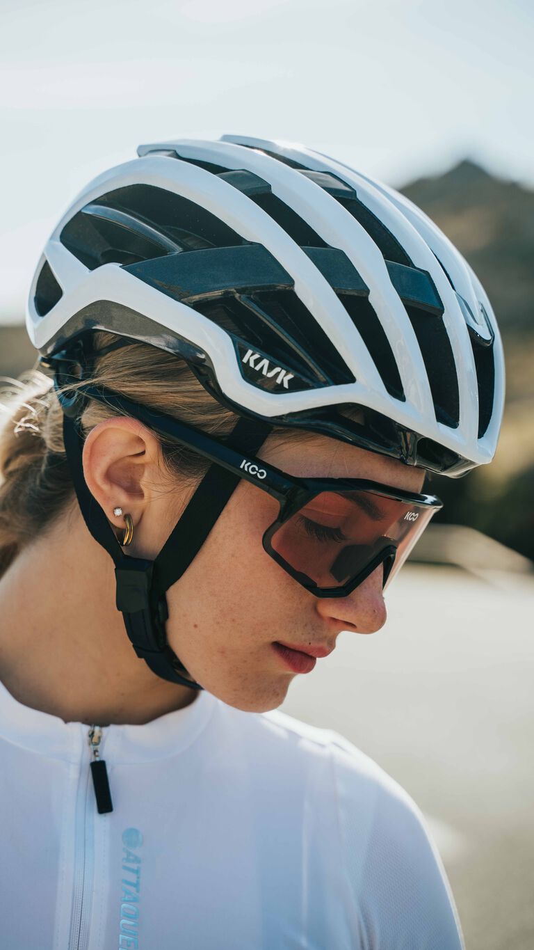 KASK Valegro cycling helmet in white and black colorway worn by cyclist