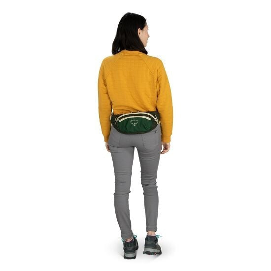 Person wearing Osprey Daylite Waist pack in green and cream around their waist