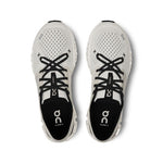 On Cloud X running shoes in ivory and black colorway, top view