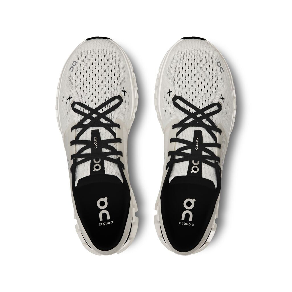 On Cloud X running shoes in ivory and black colorway, top view
