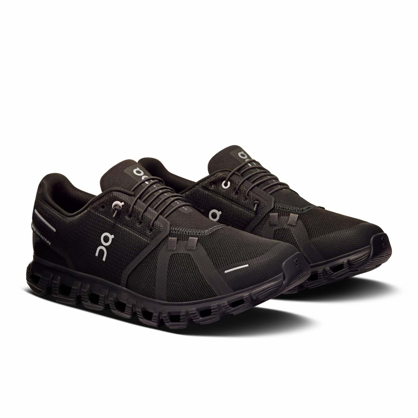 On Cloud 6 men's running shoes in black with white accents on clean background